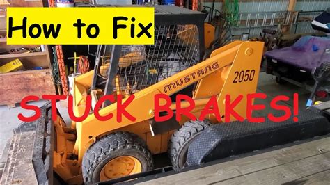 releasing a skid steer parking brake|bobcat skid steer brake release.